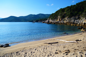 Landscape of amazing beach in Greece with blue sky clear watter and soft sand. Stagira beach.