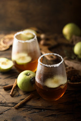 Homemade warming apple drink with fresh apples
