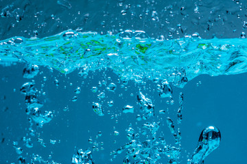 Surface of blue water against white background.
