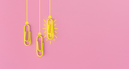 Great ideas concept with paperclip,thinking,creativity,light bulb on blue background,new ideas concept.