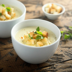 Homemade cheese soup with bread croutons