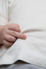 Middle finger, an offensive gesture from a newborn baby