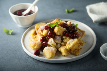 Homemade traditional Austrian pancake with cherry sauce