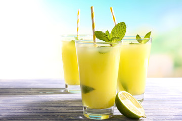 glass of orange juice on wooden table