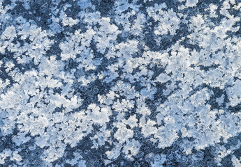 Fototapeta na wymiar Texture of ice on the frozen lake. Blue color background.