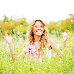 Girl starts soap bubbles