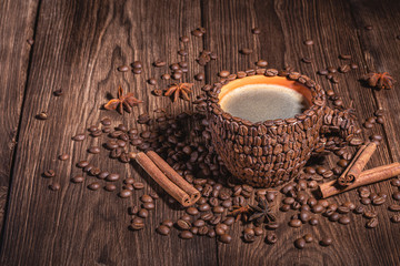 Fototapeta na wymiar Coffee cup with coffee made from coffee beans wooden table Copy space. Natural coffee beans arabica close-up macro.