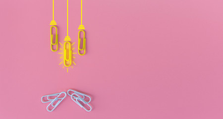 Great ideas concept with paperclip,thinking,creativity,light bulb on blue background,new ideas concept.