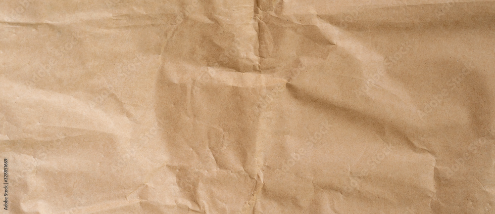 Wall mural crumpled brown paper background and texture with copy space.