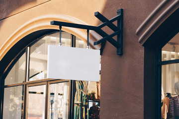 horizontal empty signage on clothes shop front with copy space.