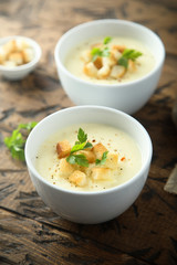Homemade cheese soup with bread croutons