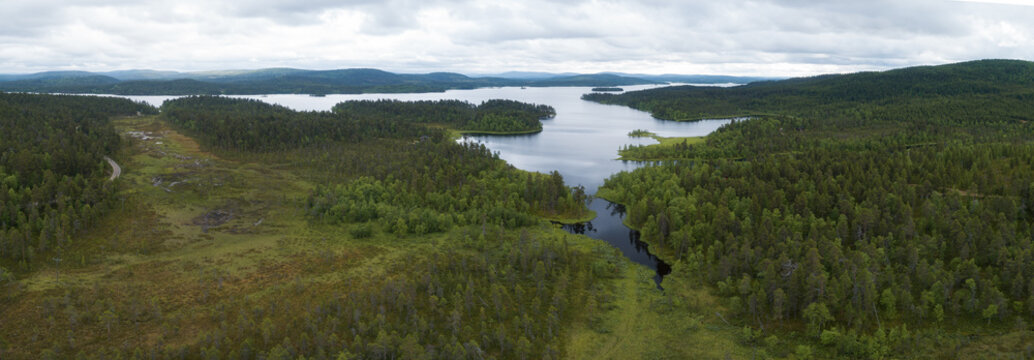 Aerial Panoramic Landscape View Of A Beautiful Bay On The Great Lakes, Lake Inari, During A Vibrant Sunset. Lapland.