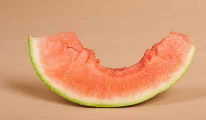 One slice of watermelon with big bite