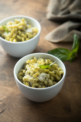 Pasta with pesto sauce and cheese