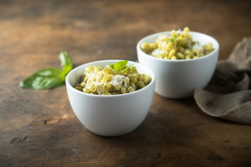 Pasta with pesto sauce and cheese