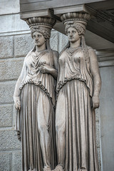 Fototapeta na wymiar Statue of two sensual Roman Renaissance Era women at Parliament building in Vienna, Austria, details, closeup