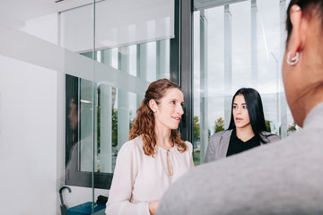 Group of office workers at a meeting around the boss