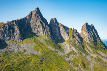 Fototapeta na wymiar Far view of peaks from Hesten hiking route, Senja Island. 