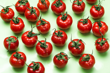Market Fresh Red Tomatoes on Green Background. Flat Lay Design