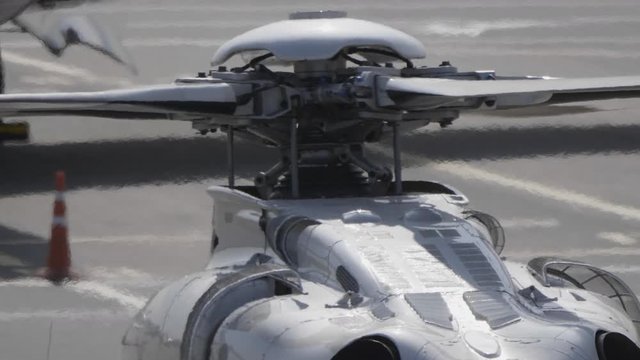 The mechanism of co-axial screws military helicopter on the background of blue sky, a close-up