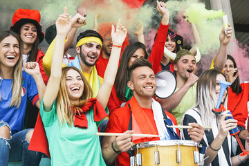 Friends football supporter fans  watching soccer match event at stadium - Young people having fun...