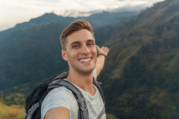 Naklejka premium self portrait picture of a man on the top of the mountain