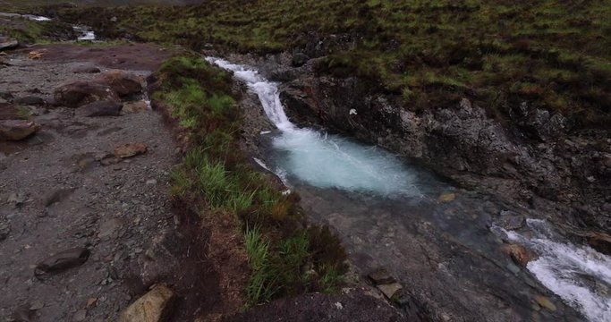 Picturesque landscape of a mountain river with traditional nature of Scotland. 4K Footage.