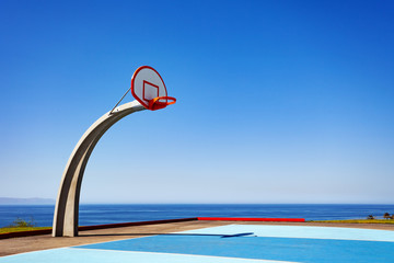 View basketball court ground with sea on background at Angel Gate Park in Los Angeles California,...