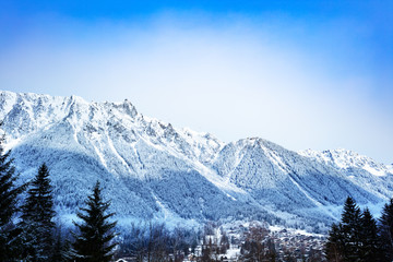 Chamonix valley with village and Le Brevent mountain during winter day, Auvergne-Rhone-Alpes region in south-eastern France