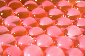 Red hydrogel balls. Bright round gel. Science. Caviar. Transparent water texture. Fresh colorful...