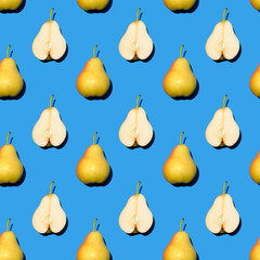 Seamless pattern with yellow pears on blue background. Flat lay composition