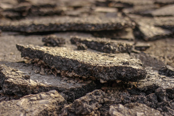 Pieces of Broken asphalt. Dismantling road surface