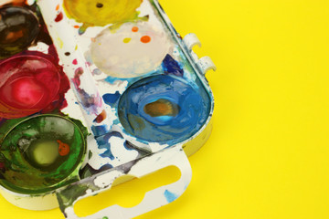 Set of watercolor paints closeup. Selective focus. Space for text