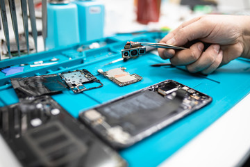 Professional smart phone repair shop or service. Close up shot. Electronics concept.