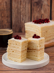 Handmade cake Milky girl - healthy recipe, gluten free, sugar free. On a wooden background, with simple cowberry decor