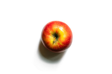 Red-yellow whole apple isolated on a white background. Top view of an apple