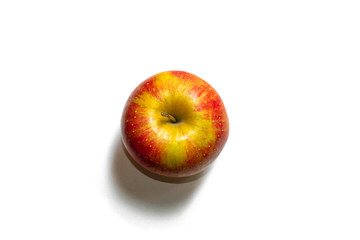 Red-yellow whole apple isolated on a white background. Top view of an apple