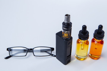 Vaping accessories on a white table. Smoking concept. Fashion for electronic cigarettes....