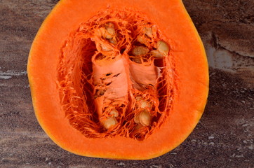 Close-up of organic butternut squash cut in half and contains seeds