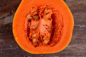 Close-up of organic butternut squash cut in half and contains seeds