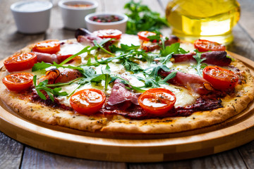 Margherita pizza on wooden table