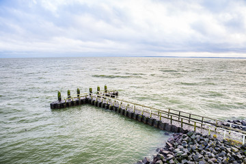 Stone pier by the Vlietermonument near Den Oever in Netherlands