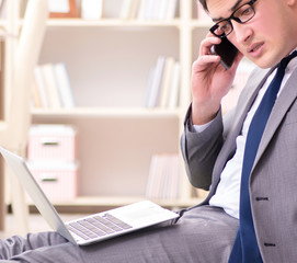 Fototapeta premium Businessman working on the floor at home