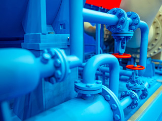 Blue pipe line. Red taps on blue pipes. Gas distribution system. Gas pipelines. Transportation of fuel through pipes. Liquefied natural gas. Red valves. Pipe connection. Chemical industry.