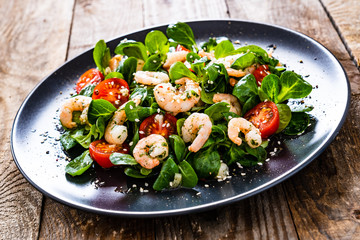 Prawn salad on wooden table