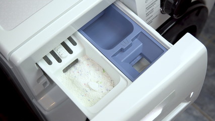 Special compartment in the washing machine for powder and liquid