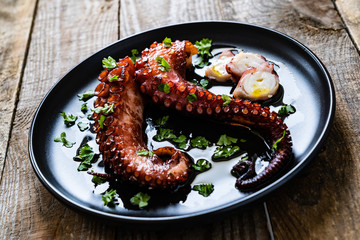 Barbecue octopus on wooden table