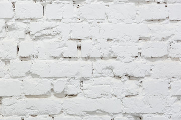 Fototapeta premium Brick wall painted with white paint background.