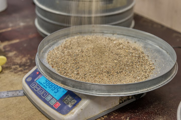 Sand tray on a laboratory balance.