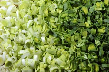 Fototapeta premium Photography of thinly sliced leek from white to green for food background